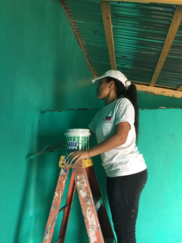 Painting the inside of the house green (the families wanted the house to resemble a rose). 